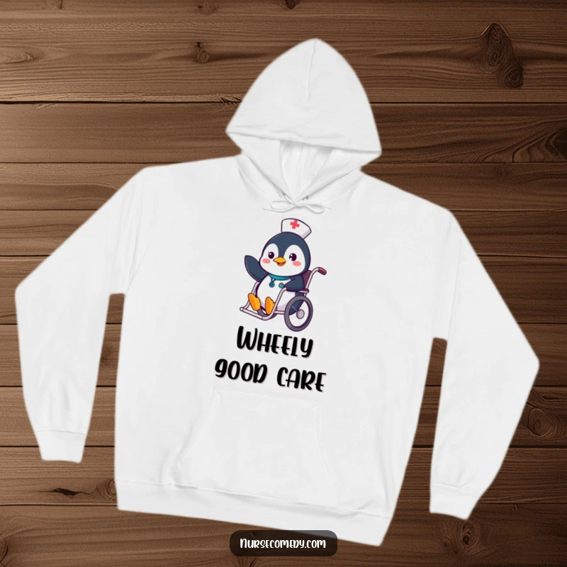 Cozy Funny Penguin Nurse Hoodie with a cheerful penguin sliding in a wheelchair, perfect for warmth and humor.