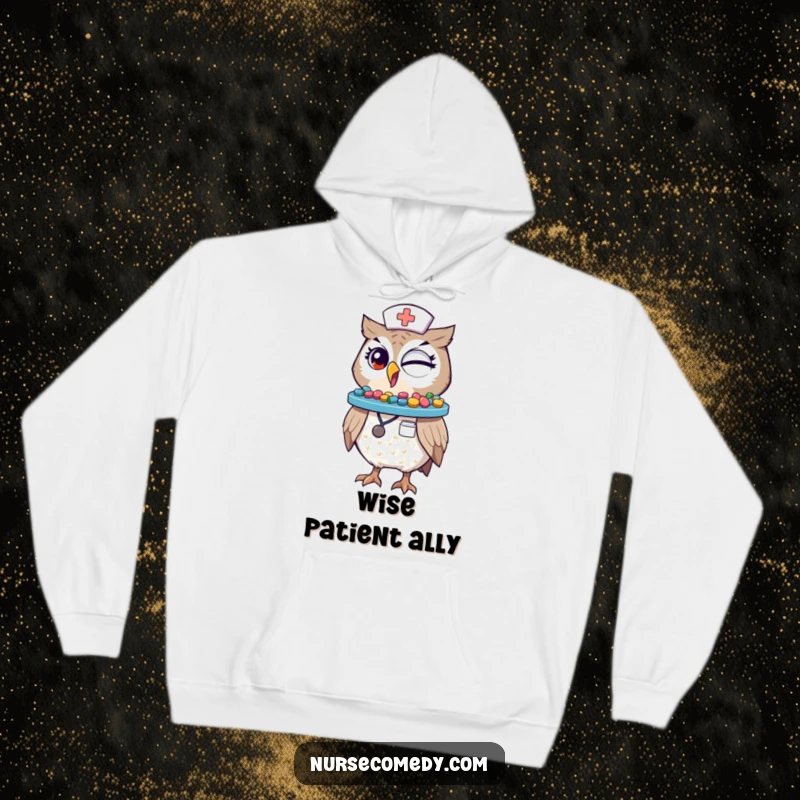 Funny Winking Owl Nurse Hoodie: A charming owl nurse character winks while balancing a tray of vibrant pills on its beak.
