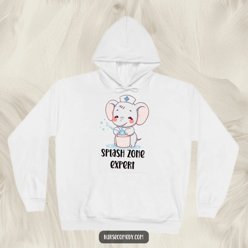 Funny Kawaii Elephant Nurse Hoodie, adorable cartoon elephant gently splashing water from a tiny bucket, perfect for cheerful comfort.