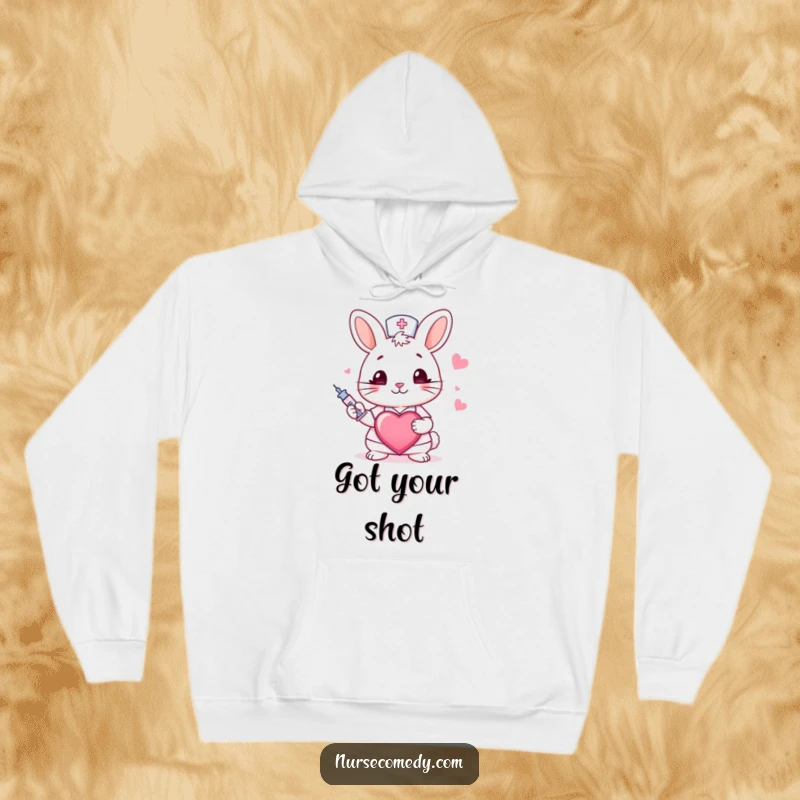 Funny rabbit nurse hoodie featuring a winking bunny holding a syringe and heart, providing warmth and humorous appreciation for medical staff.