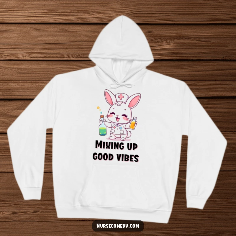 Funny Hoodie: An excited bunny nurse holds and gives a colorful potion. Cozy, vibrant, and full of magical care.