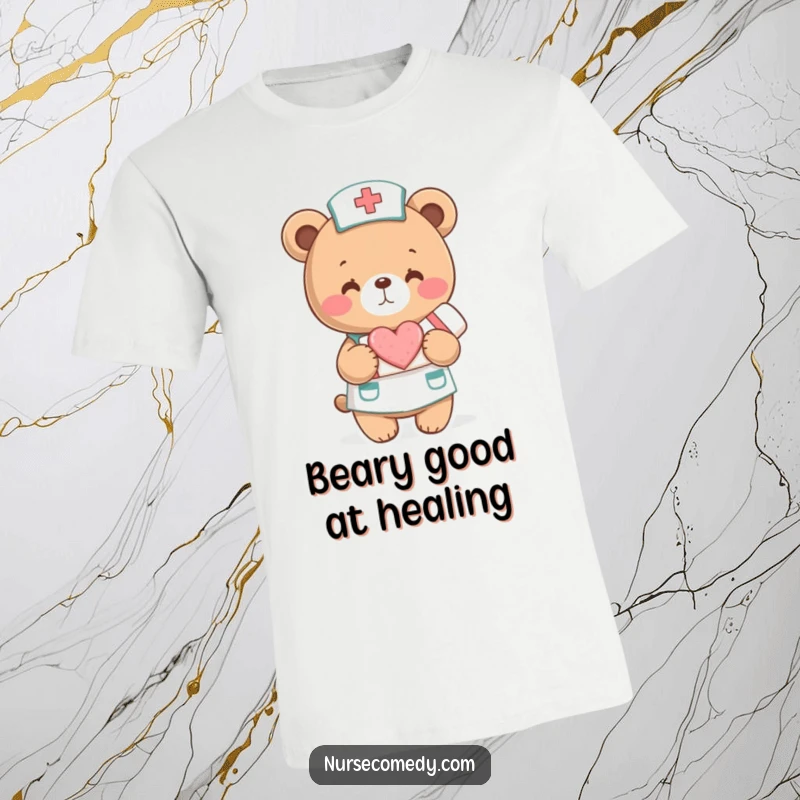 Funny T-Shirt: A bear in a nurse uniform holds a heart-shaped bandage. Comforting and humorous attire.